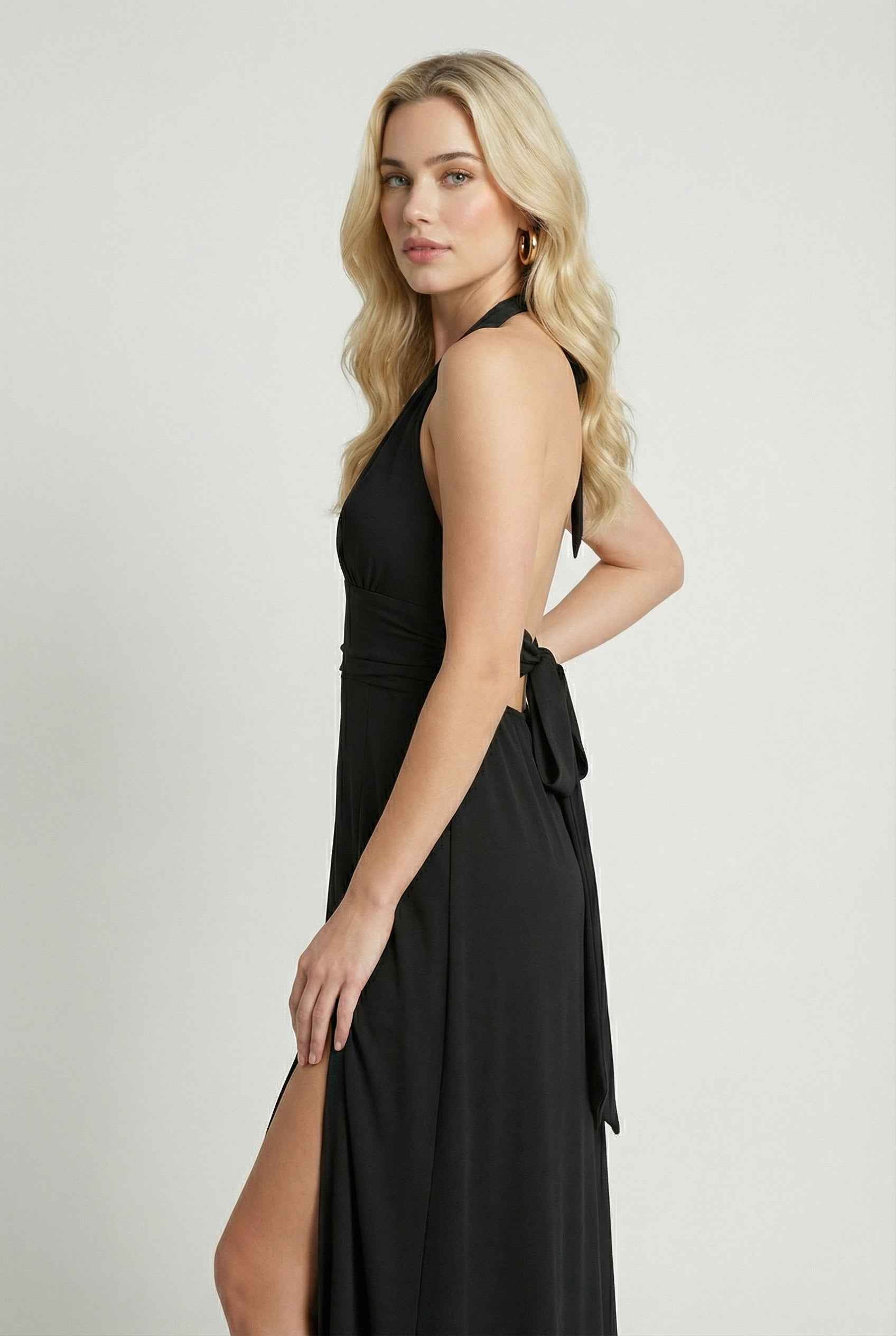 Elegant black halter neck dress by Lumina Wear, featuring a versatile fit and stylish design perfect for formal occasions.