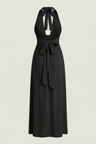 Elegant black halter neck dress by Lumina Wear, showcasing a versatile fit and flowing fabric for stylish occasions.