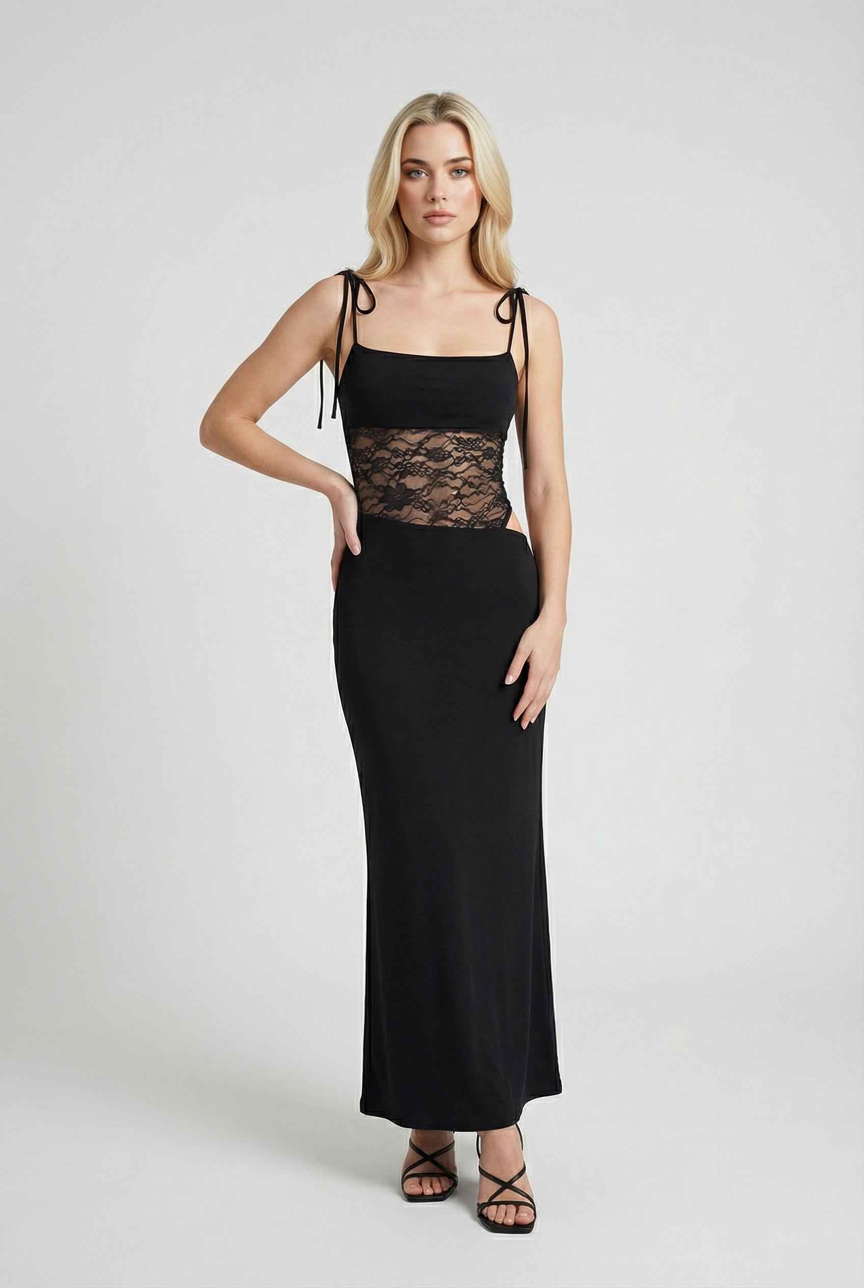 Elegant black lace dress with a flowy design from Lumina Wear, perfect for casual occasions, featuring intricate lace details.