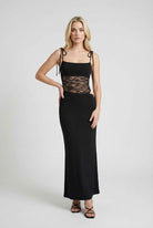 Elegant black lace dress with a flowy design from Lumina Wear, perfect for casual occasions, featuring intricate lace details.