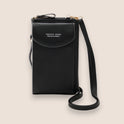 Elegant black leather clutch bag with versatile strap by Lumina Wear, featuring a sleek design and compact size.