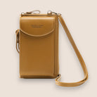 Elegant black leather clutch bag with versatile strap by Lumina Wear, featuring a sleek design and compact size for stylish occasions.
