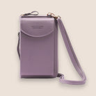 Elegant black leather clutch bag with versatile strap from Lumina Wear, featuring a sleek design and compact size for stylish occasions.