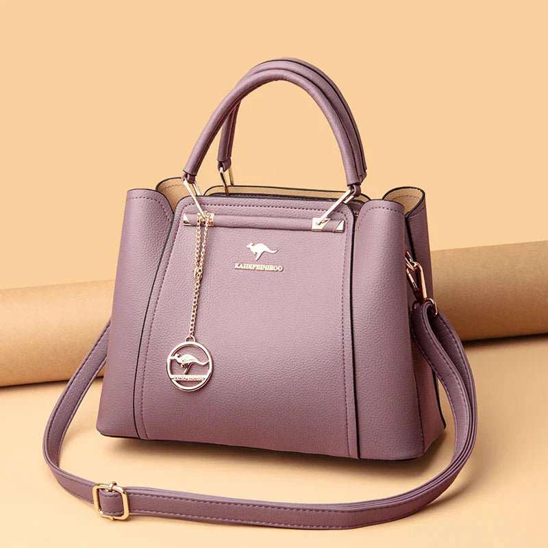 Elegant black leather handbag with gold accents from Lumina Wear's Isabella collection, showcasing a stylish and sophisticated design.