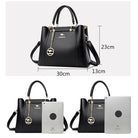 Elegant black leather handbag by Lumina Wear featuring gold accents, with structured design and top handle for versatile style.