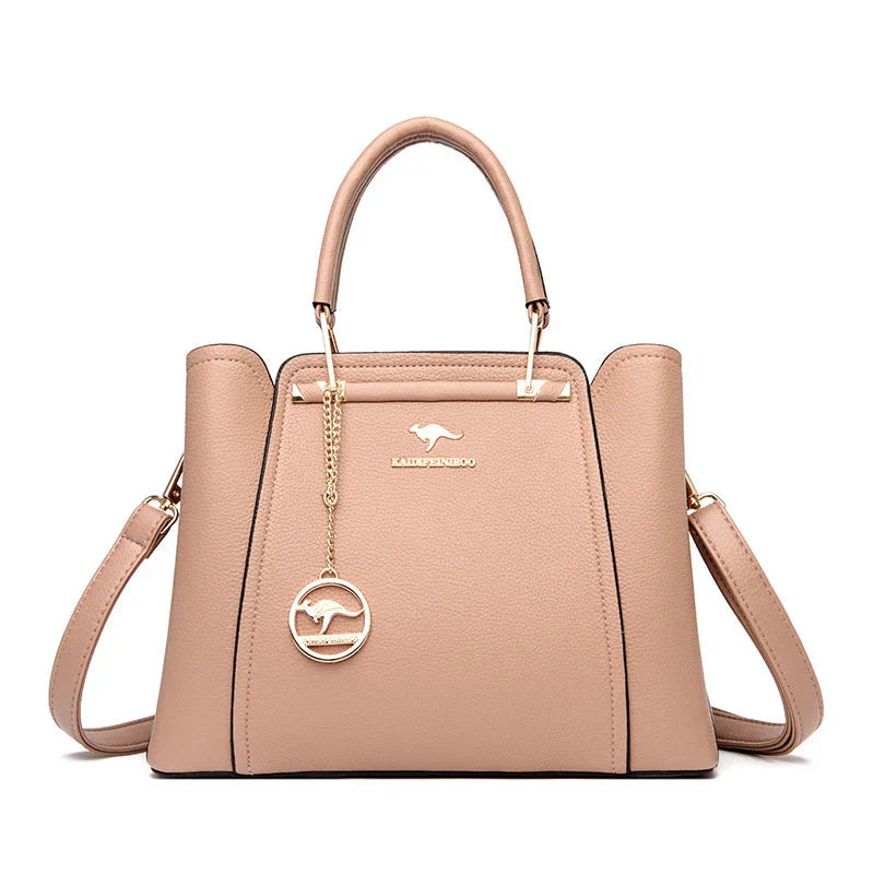 Elegant black leather handbag with gold accents from Lumina Wear's Isabella collection, featuring a sleek design and structured silhouette.