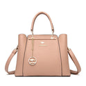 Elegant black leather handbag with gold accents by Lumina Wear, featuring a structured design and sleek handles.