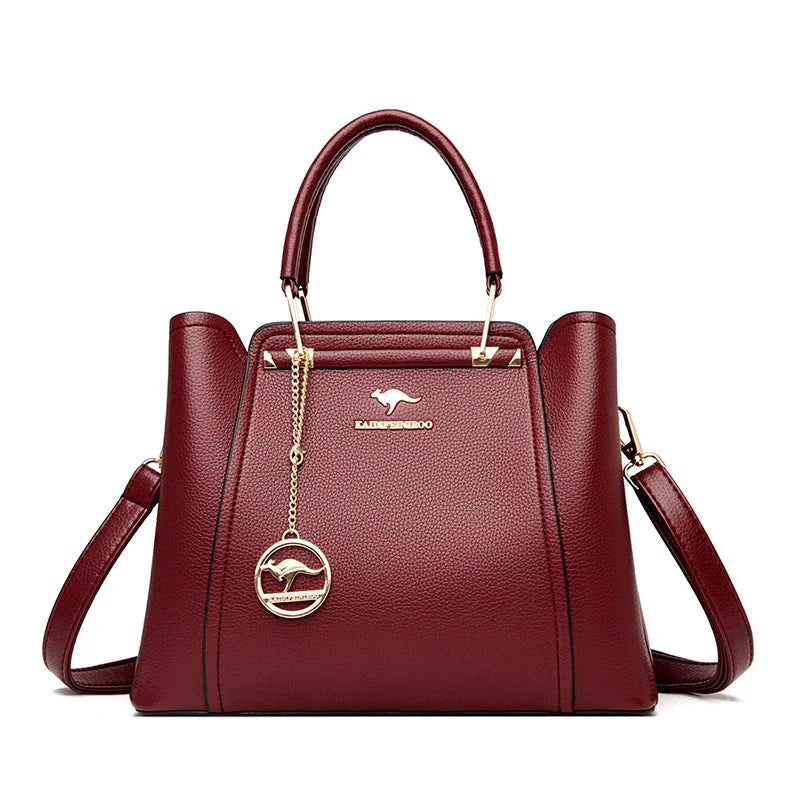Elegant black leather handbag with gold accents from Lumina Wear's Isabella collection, featuring a structured design and stylish details.