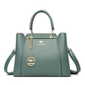 Elegant black leather handbag with gold accents by Lumina Wear, featuring a sleek design and stylish metal hardware.