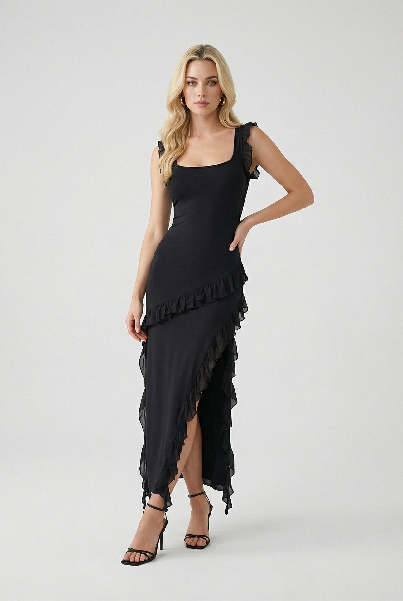 Elegant black maxi dress with high slit from Lumina Wear, featuring a flowing fabric and sleek silhouette for women's fashion.