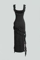 Elegant black maxi dress with high slit from Lumina Wear, featuring a fitted bodice and flowing skirt for women.
