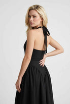 Elegant black midi dress by Lumina Wear featuring a flattering fit, perfect for stylish occasions.