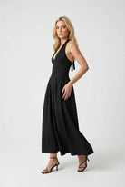 Elegant black midi dress by Lumina Wear, featuring a flattering fit and stylish design, perfect for formal occasions.