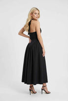 Elegant black midi dress from Lumina Wear featuring a flattering fit and stylish design, perfect for formal occasions.