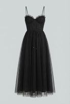 Elegant black midi dress by Lumina Wear, sleeveless design with a fitted silhouette, perfect for formal occasions.