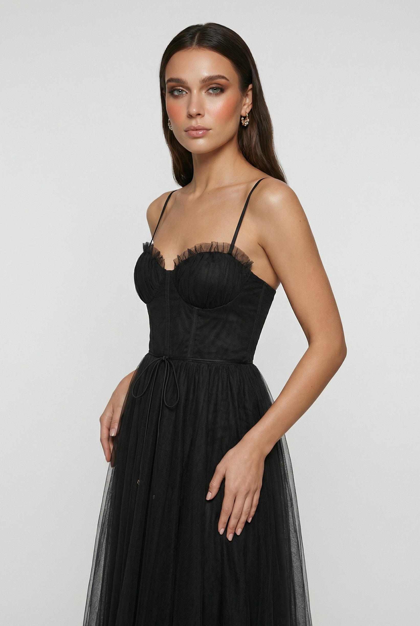 Elegant black sleeveless midi dress named Isabella by Lumina Wear, shown with smooth fabric and fitted silhouette.
