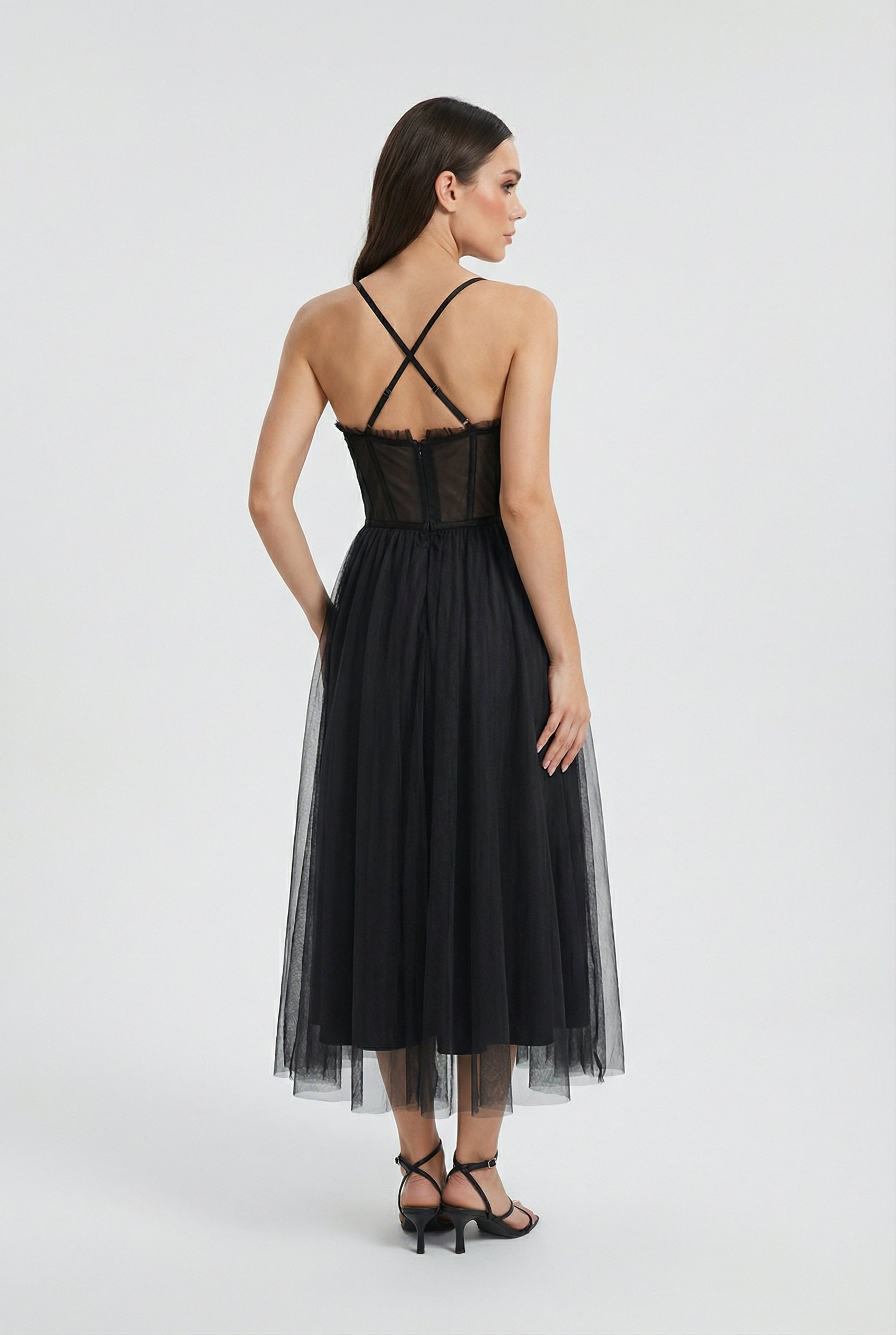 Elegant black sleeveless midi dress by Lumina Wear, featuring a fitted silhouette and stylish design, perfect for formal occasions.