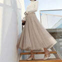 Elegant black tulle skirt by Lumina Wear, featuring a flattering fit and stylish design, perfect for women’s fashion.