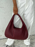Elegant black vegan leather tote bag from Lumina Wear with spacious interior and sleek design, perfect for everyday use.