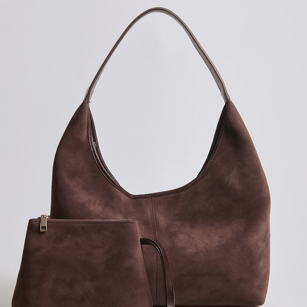 Elegant black vegan suede tote bag from Lumina Wear, featuring a spacious design and sleek hand-held style.