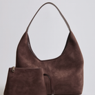 Elegant black vegan suede tote bag from Lumina Wear, featuring a spacious design and sleek hand-held style.