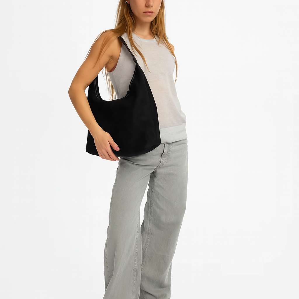 Elegant black vegan suede tote bag from Lumina Wear, featuring a spacious design and sleek handles for stylish everyday use.