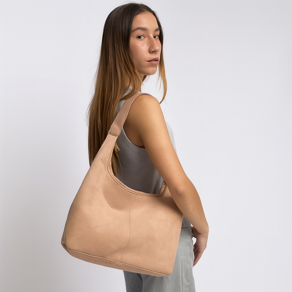 Elegant black vegan suede tote bag by Lumina Wear, featuring a spacious design and sturdy handles on a white background.