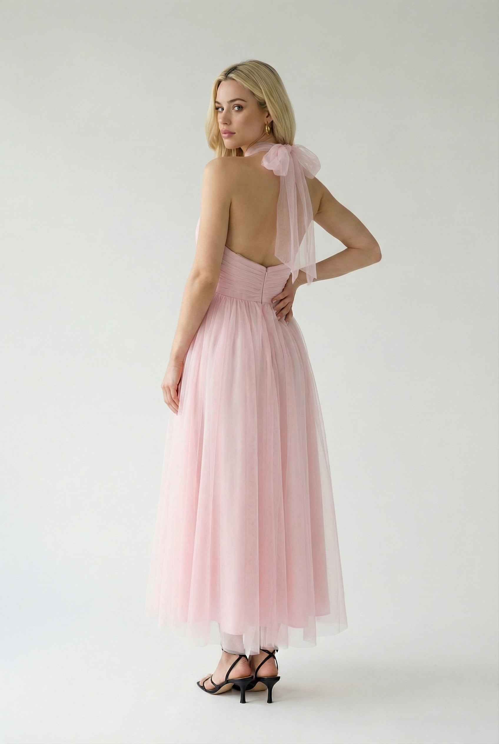 Elegant blush midi dress by Lumina Wear featuring a flattering silhouette, perfect for sophisticated occasions.