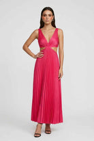 Elegant blush pink pleated dress with flowing silhouette by Lumina Wear, featuring a stylish and graceful design.
