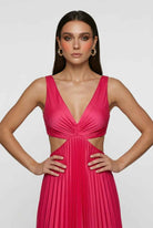 Elegant blush pink pleated dress with flowing silhouette by Lumina Wear, featuring a stylish and graceful design.