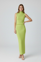 Elegant green knit skirt and top set by Lumina Wear, featuring a flattering fit in a stylish two-piece dress ensemble.