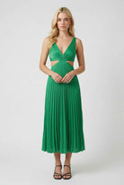 Elegant green pleated maxi dress by Lumina Wear featuring flowing design and sophisticated style.