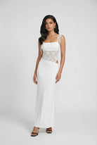 White women's lace dress by Lumina Wear, featuring an elegant design and flattering silhouette for sophisticated style.