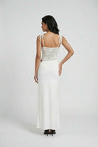 White women's dress with elegant lace details and a flattering silhouette from Lumina Wear.