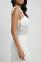 White women's dress by Lumina Wear featuring elegant lace details and a flattering silhouette, perfect for formal occasions.