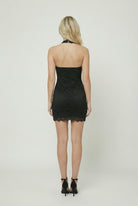 Black lace mini dress by Lumina Wear featuring an elegant design and comfortable fit, perfect for stylish occasions.
