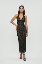 White lace maxi dress by Lumina Wear featuring a flattering fit and elegant design, perfect for formal occasions.