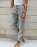 Light beige lightweight linen trousers from Lumina Wear, styled as elegant pants with a relaxed fit.