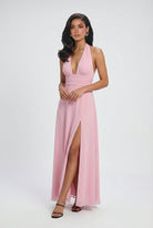 Elegant pink women's dress by Lumina Wear featuring a versatile cut, showcased on a model with flowing fabric and stylish design.