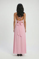 Elegant pink women's dress by Lumina Wear, featuring a versatile cut and feminine design, perfect for stylish occasions.