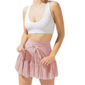 Light brown Isabella Lumina Wear pleated mini skirt with integrated shorts, stylish and elegant for casual or dressy outfits.