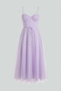 Elegant purple midi dress by Lumina Wear featuring a flattering silhouette, perfect for stylish occasions.