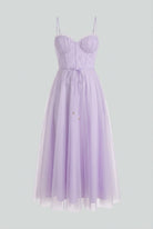 Elegant purple midi dress by Lumina Wear featuring a flattering silhouette, perfect for formal occasions and stylish events.