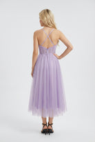 Elegant purple midi dress by Lumina Wear featuring a flattering silhouette, perfect for stylish occasions.