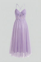 Elegant purple midi dress by Lumina Wear featuring a flattering silhouette, perfect for sophisticated occasions.