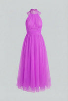 Elegant purple midi dress by Lumina Wear featuring a versatile cut, perfect for women’s fashion occasions.