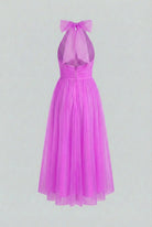 Elegant purple midi dress by Lumina Wear featuring a versatile cut, perfect for women's fashion and special occasions.