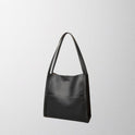 Elegant structured leather shoulder bag by Lumina Wear, featuring spacious design and brown color for stylish everyday use.