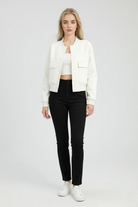 Elegant white bomber jacket from Lumina Wear featuring timeless design, shown on a model with stylish details and a modern fit.