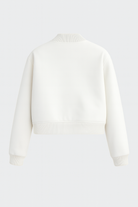 Elegant white bomber jacket by Lumina Wear featuring a timeless design, showcased on a model wearing the Isabella style.